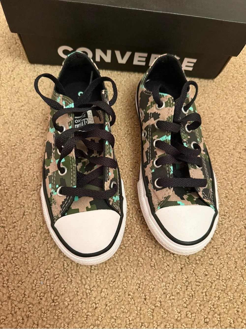 New in box. Converse low sneakers. Size 12